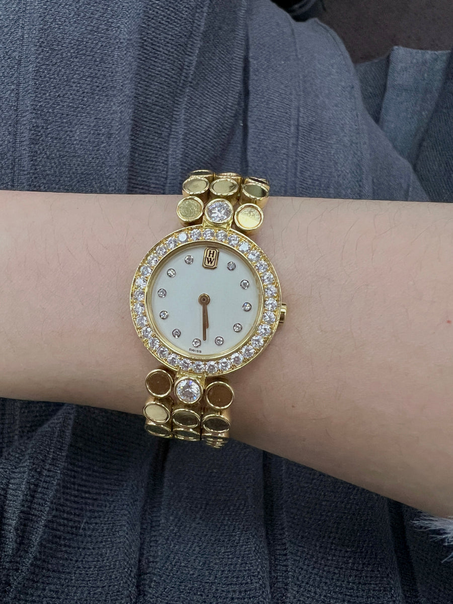 Harry Winston Lady's Watch in 18K Yellow Gold and Diamonds.