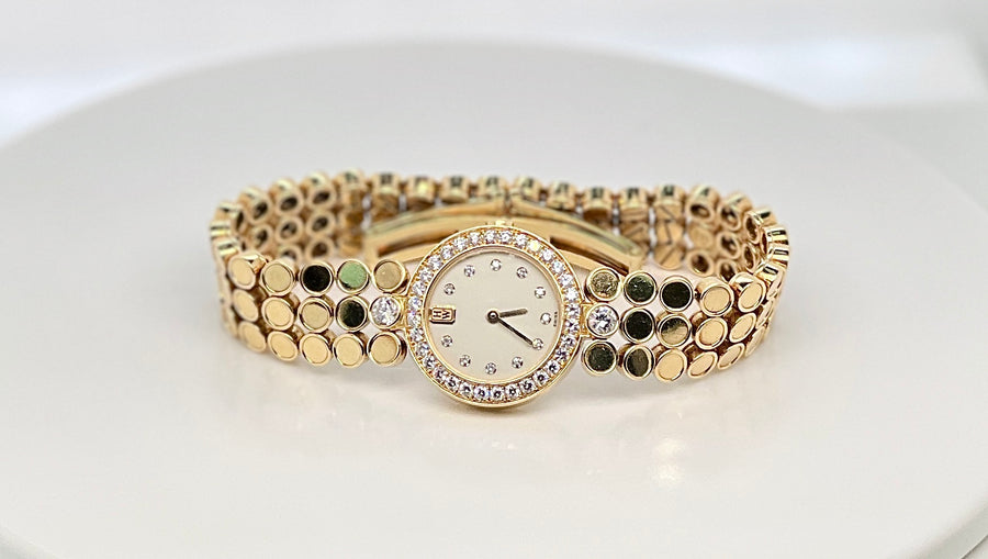 Harry Winston Lady's Watch in 18K Yellow Gold and Diamonds.
