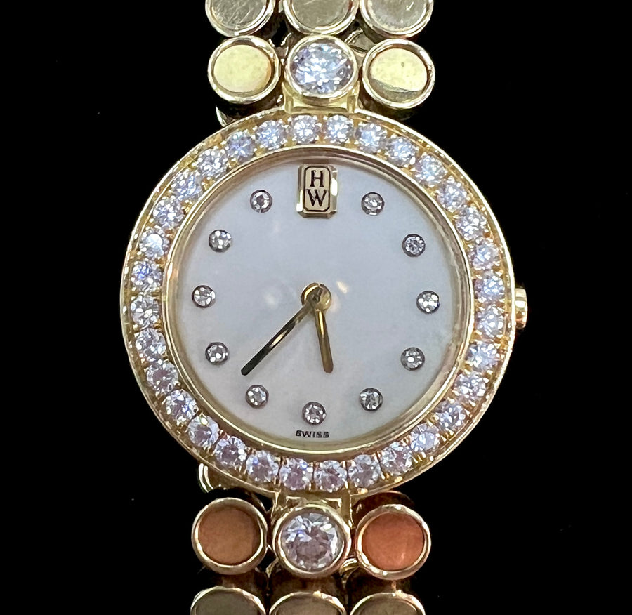 Harry Winston Lady's Watch in 18K Yellow Gold and Diamonds.