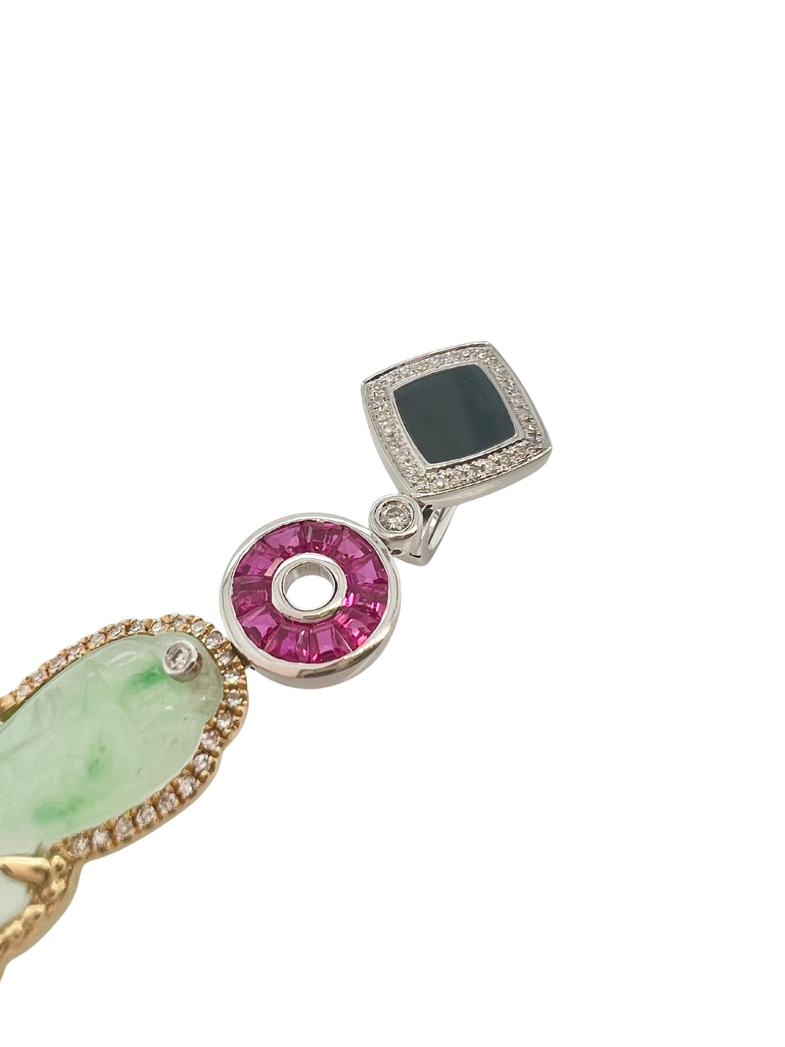 Pair of Carved Jade, Two-Color Gold, Ruby, Onyx, and Diamond Pendant Earrings